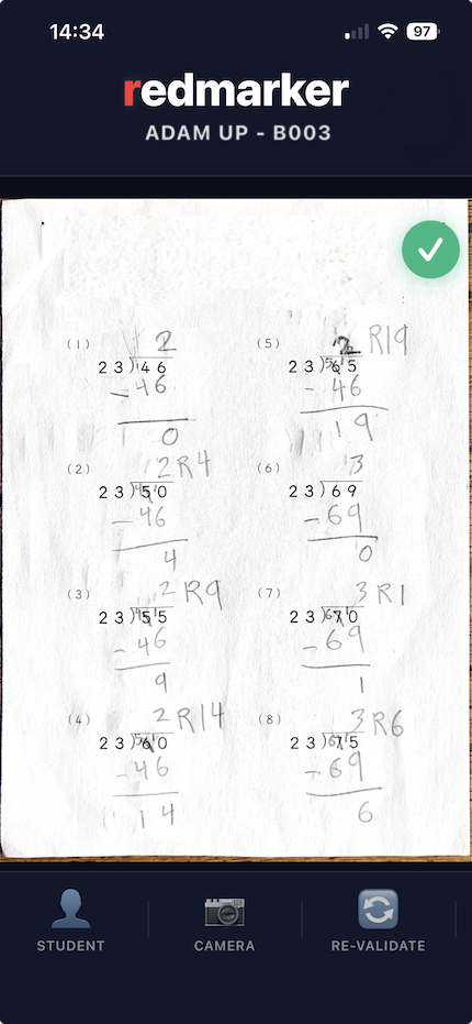 Close-up of a handwritten maths worksheet with scribbles, eraser smudges and tight red ticks beside each answer.